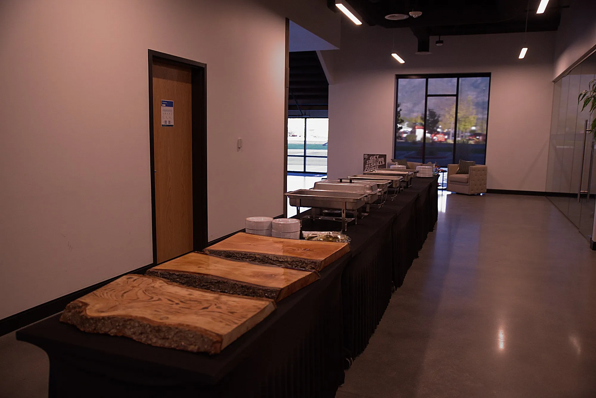 A long buffet counter down an empty corridor before service